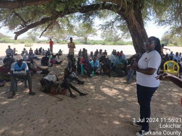 Community engagement session under a tree, Lokichar